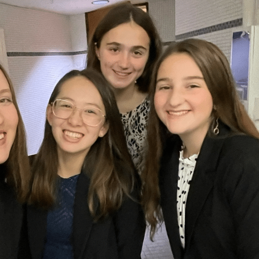 four girls smiling