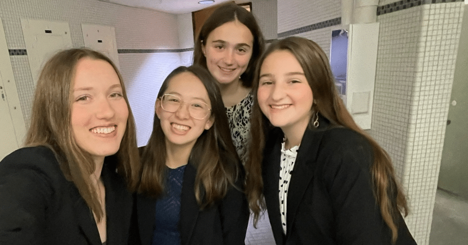 four girls smiling