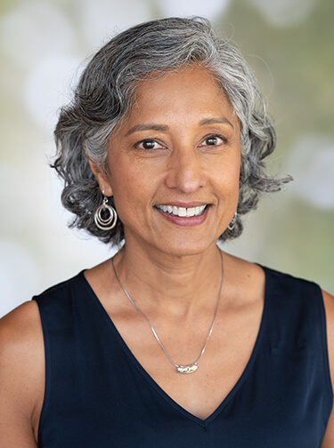 Hema Ramachandran is a brown-skinned woman with gray hair