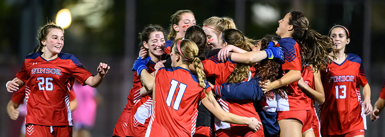 The Winsor School Soccer Team hugging