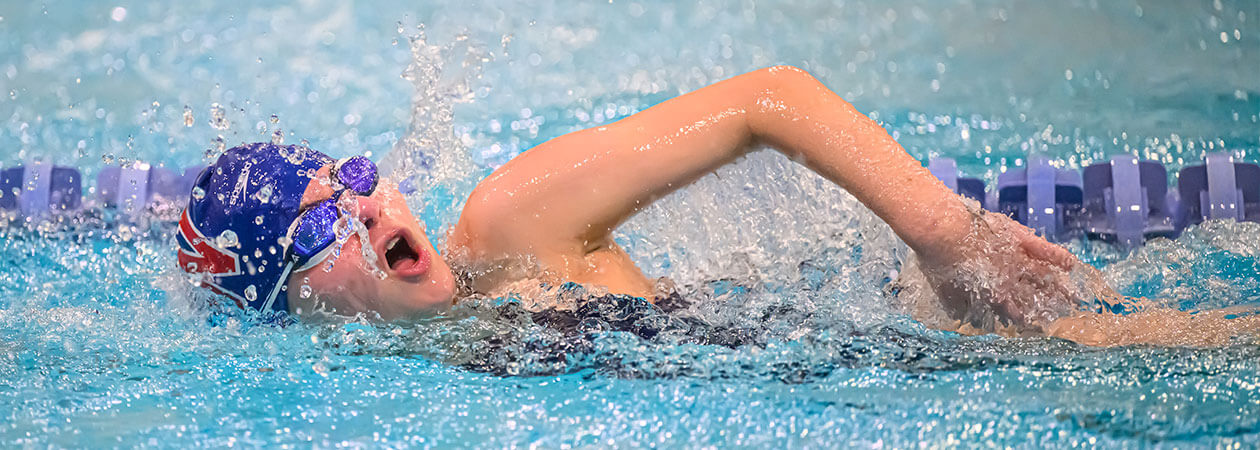 Girl competitive swimming at The Winsor School