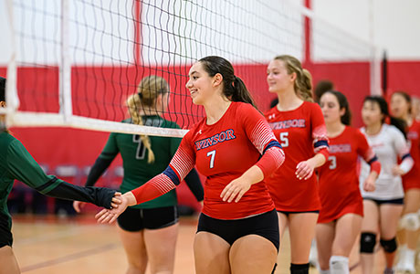 The Winsor school volleyball team shaking hands