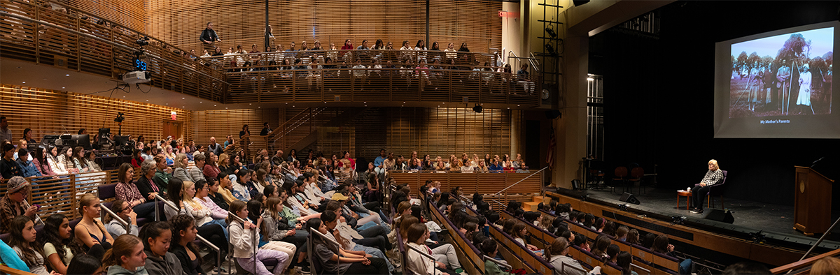 large group of students at meeting in assembly hall