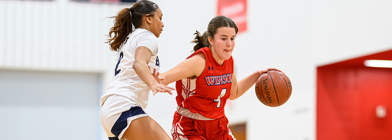 two girls playing basketball