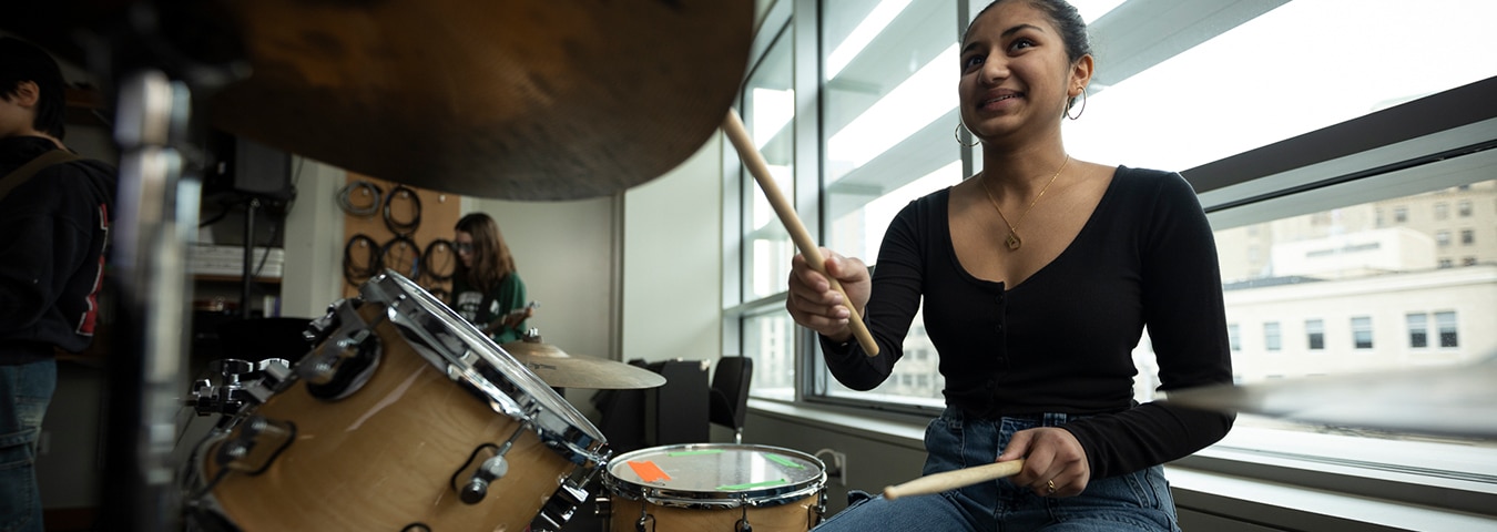 Girl playing drums