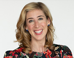 white woman with blonde hair and floral dress