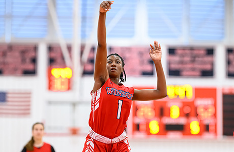 young girl of color playing basketball