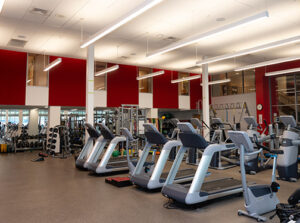 weight room with treadmills and free weights