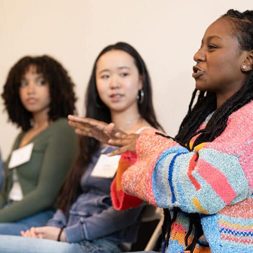 A diverse panel of four students answering questions