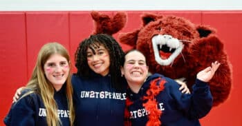 Three students and a school mascot