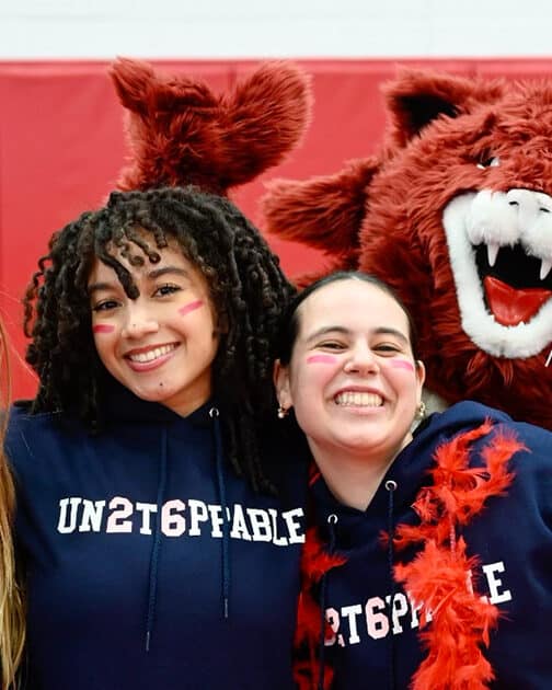 Three students and a school mascot