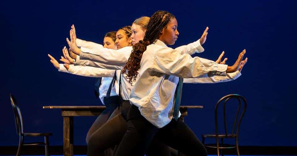 Students in a dance line on stage