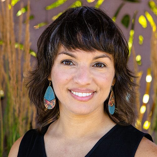 Headshot of female author Mónica Guzmán